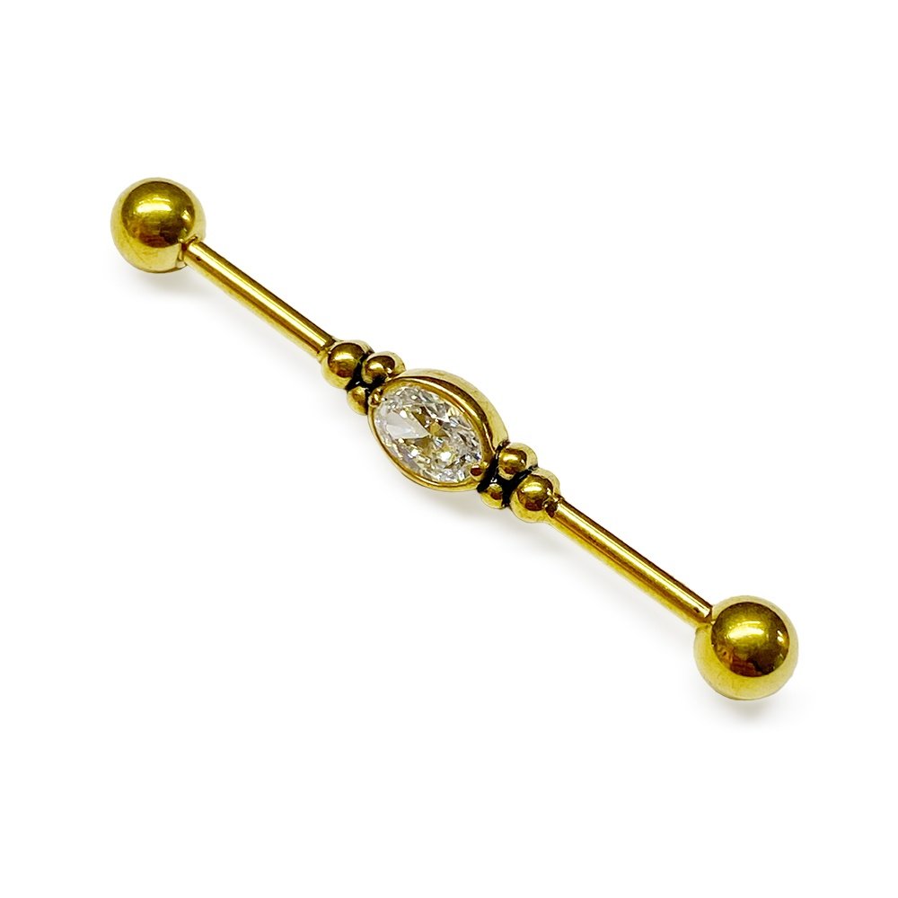 Piercing industrial de oro con circonia ovalada ZUK Lleida