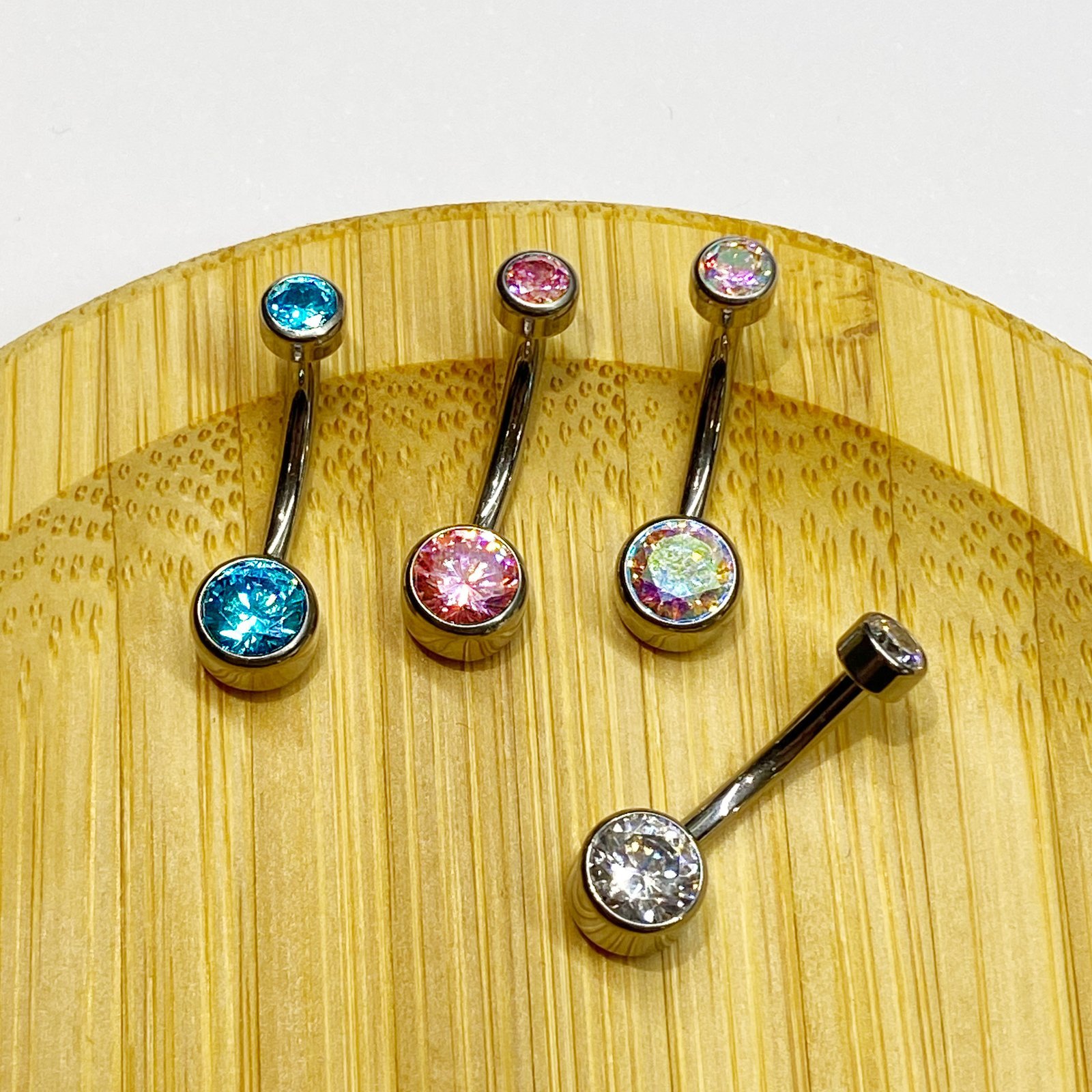 Piercing de ombligo con 2 zirconias rosas corte bisel - Imagen 2