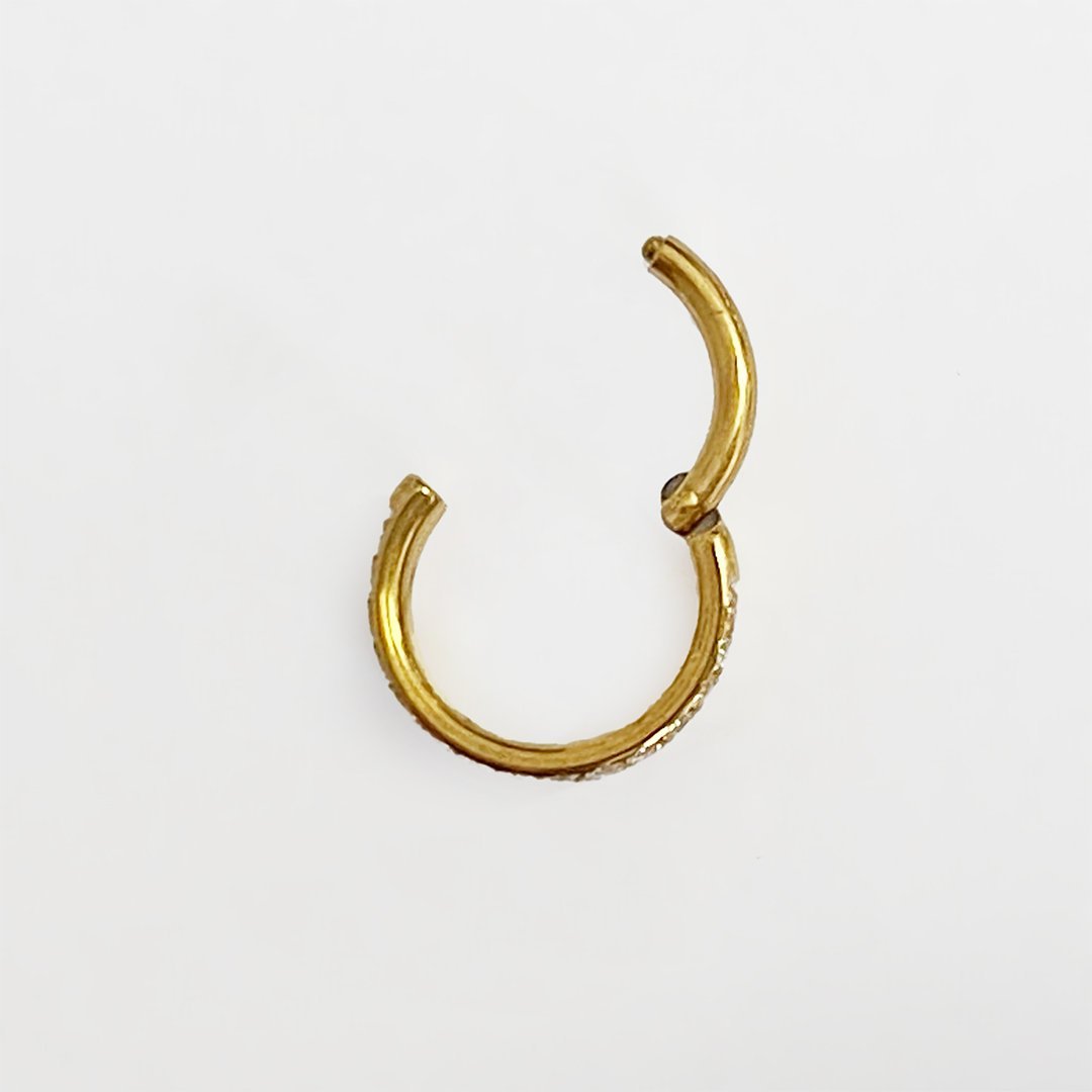 Clicker de titanio con baño de oro y 3 hileras de zirconias - Imagen 2