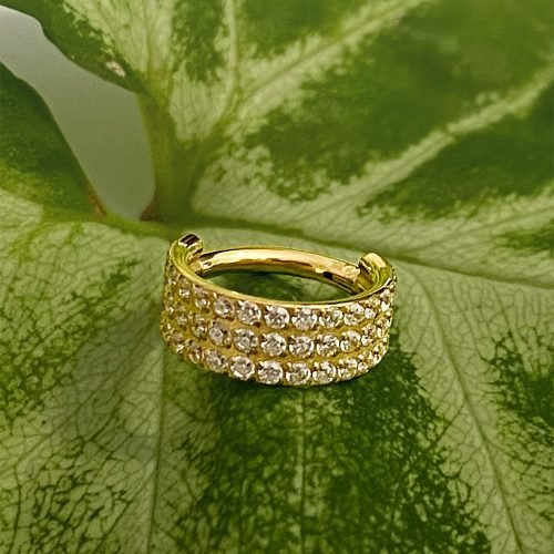 Clicker de titanio con baño de oro y 3 hileras de zirconias