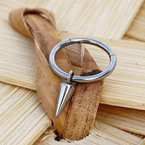 Clicker de titanio con un pincho