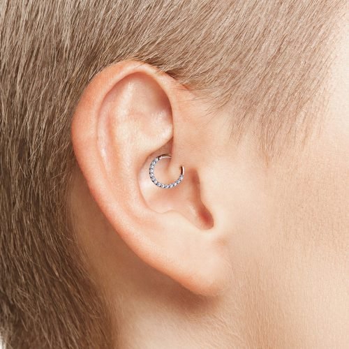 Alternative view of Clicker de titanio con baño de oro rosa y zirconias frontales