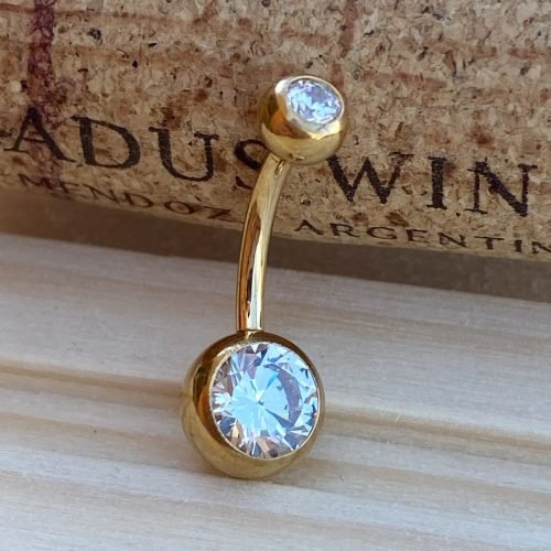 Piercing de ombligo de titanio con baño de oro y 2 zirconias