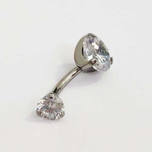 Alternative view of Piercing de titanio. De ombligo con 2 zirconias engarzadas