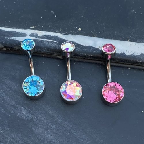 Piercing de ombligo de titanio con 2 zirconias corte bisel