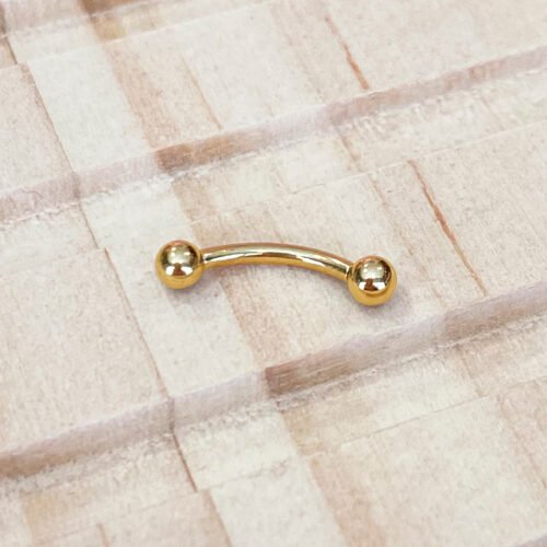 Piercing banana de titanio y baño de oro con rosca interna de 0,8